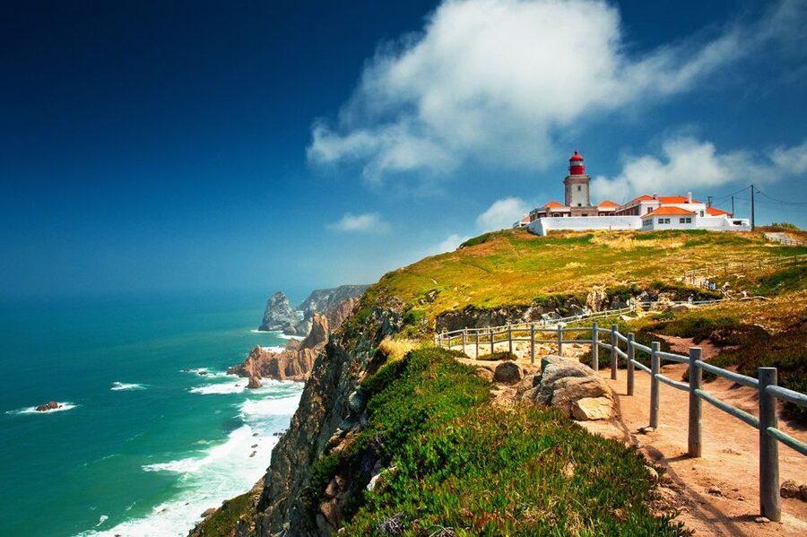Cascais: City, Cabo da Roca, and Sintra Tuk-Tuk Tour - Praia do Guincho: kitesurfers, wind, and the kind of ocean you notice