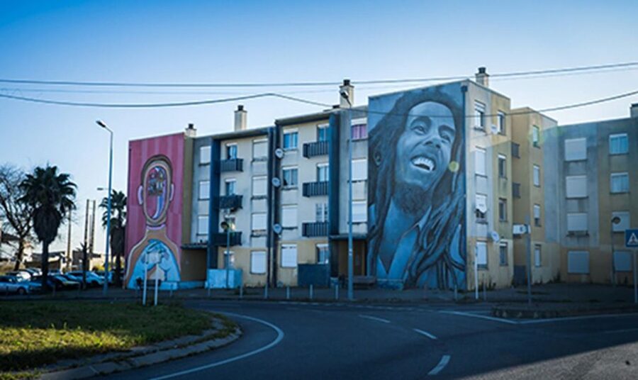 Chaparru</code>s Street Art Tuk Tuk Tour 3 H – Iconic artists you may spot, and how to look at their work’ /><br />
The tour includes street art works by a long list of creators. You may see major names including <strong>Vhils</strong>, <strong>Bordalo II</strong>, <strong>akacorleone</strong>, <strong>Smile</strong>, <strong>±maismenos±</strong>, <strong>Tamara Alves</strong>, <strong>Mário Belém</strong>, <strong>ADD FUEL</strong>, <strong>GONÇALO MAR</strong>, <strong>KRUELLA D’ENFER</strong>, <strong>ODEITH</strong>, <strong>RAM</strong>, <strong>Raf</strong>, <strong>Felipe Pantone</strong>, and <strong>Third</strong>. Other artists listed include <strong>Daniel Eime</strong>, <strong>Cix (Mugre Crew)</strong>, <strong>Godmess</strong>, <strong>Hazul</strong>, <strong>LS</strong>, <strong>VANESSA GALDEANO & ANALI CHANQUIA</strong>, <strong>Miguel Januário</strong>, <strong>Nomen</strong>, <strong>Paulo Arraiano</strong>, <strong>Pichi&Avo</strong>, <strong>Miguel Brum</strong>, <strong>Mariana Santos</strong>, <strong>Jorge Charrua</strong>, <strong>Sofia Cruz</strong>, <strong>Carlos Farinha</strong>, <strong>Robert Panda</strong>, and <strong>ANDRÉ SARAIVA</strong>, plus additional artists.</p>
<p><p>You do not need to recognize them all to enjoy the tour, but knowing what to look for makes a huge difference. Here are simple things that work with most styles you’ll encounter:</p>
</p>
<ul>
<li><strong>Line and texture:</strong> Some artists build images out of sharp edges and shapes, others use texture as the main effect.</li>
<li><strong>Typography vs. character:</strong> Text-heavy works often feel like public dialogue. Character-driven pieces feel like portraits.</li>
<li><strong>Scale choices:</strong> A small piece can be experimental. A big piece usually has a stronger message or impact.</li>
<li><strong>Material cues:</strong> Even from the street, you can often tell whether a piece was designed to blend in or to fight for attention.</li>
</ul>
<p><p>One of the best parts of doing this in a guided format is that you can go from seeing a name to understanding how the style works.</p>
</p>
<h2>LX Factory: why the tour includes a renewed Lisbon space</h2>
<p><img width="900" height="536" decoding="async" src=
