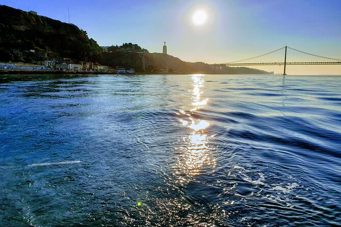 Daytime/Lisbon Sunset Boat with history and wine (small group) - Vinho verde, blankets, and photo breaks that actually matter