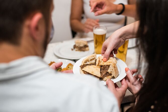 Devour Lisbon Food & Fado Tour Mouraria & Alfama Neighbourhoods - Start at Praça da Figueira, then return there again