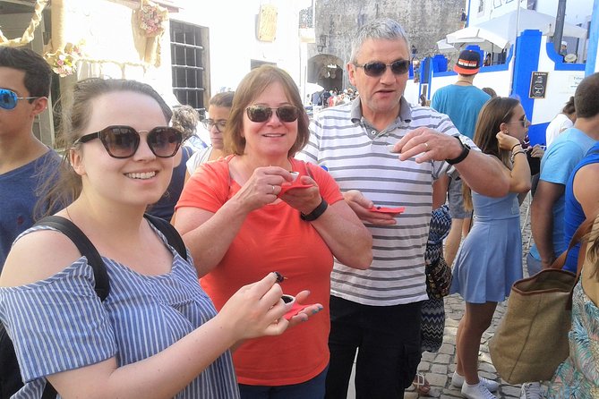 Fátima Sanctuary, Óbidos Medieval and Nazaré from Lisbon - Óbidos medieval lanes, cobbles, walls, and ginjinha in chocolate cups