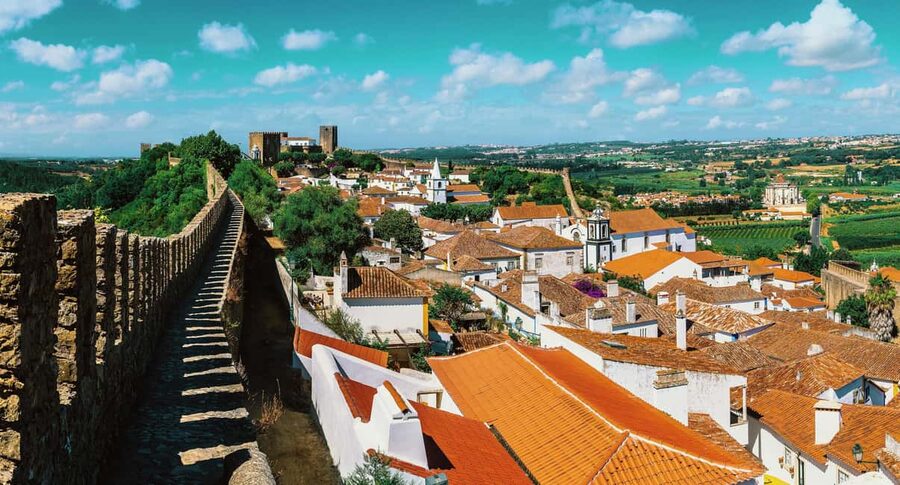From Lisbon: Nazare Big Waves and Óbidos Guide Day Trip - Óbidos: Walled Streets, the Castle Surroundings, and Ginjinha