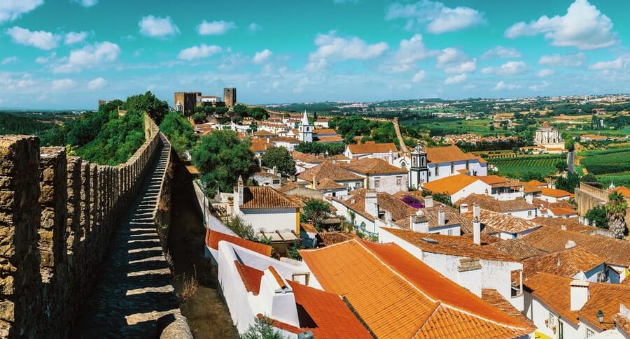 From Lisbon: Nazare Big Waves and Óbidos Guide Day Trip - Price and Timing: Is This Day Trip Good Value?