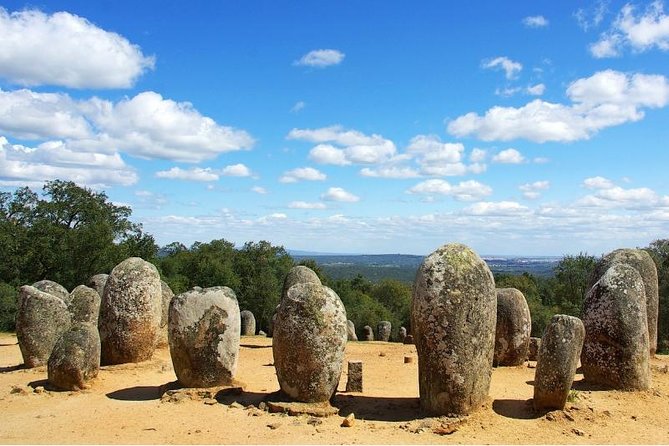 From Lisbon to Alentejo: Évora and Megaliths Full-Day Group Tour - Getting from Lisbon: pickup, minivan comfort, and bridge views
