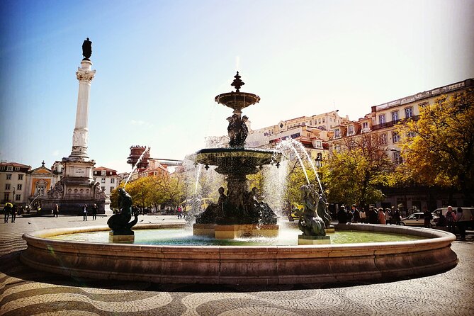 Full Day Lisbon Tour Baixa Chiado with Alfama and Belem - Arco do Triunfo, Rua Augusta, and Rossio: the rebuilt city meets street life