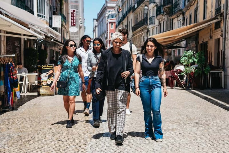 Lisbon: Baixa District Food Tour with Dinner and Drinks - Walking the core streets toward Praça Dom Pedro IV