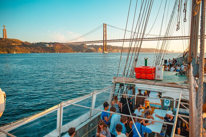 Lisbon Boat Party BIGGEST Sunset Cruise — with Music & Drinks - Santa Apolónia and Ribeira das Naus: The Night-Glow Stretch