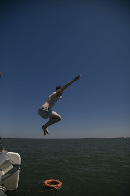 Lisbon: Catamaran Boat Party with Music, Open Bar & Dives - Should you book this Lisbon catamaran boat party?