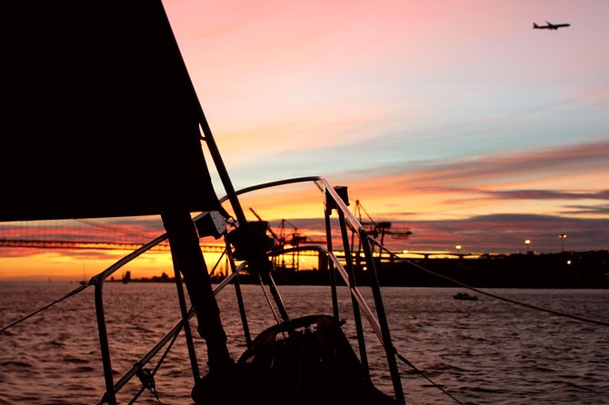 Lisbon: Daylight or Sunset on a Vintage Sailboat - Sunset cruising on the Tagus: wine, petiscos, and the 25 de Abril Bridge moment