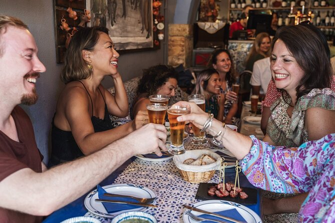 Lisbon Flavours: Baixa Guided Food Tour with Portuguese Wine - Supremo Tribunal de Justiça start, Carpe Diem Tours sign in hand