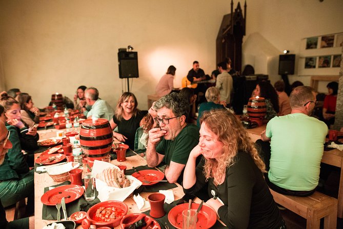 Lisbon Food Tour with 3 Stops and Fado Show Performance - Drinks, seafood, pork, and what alcohol is actually included