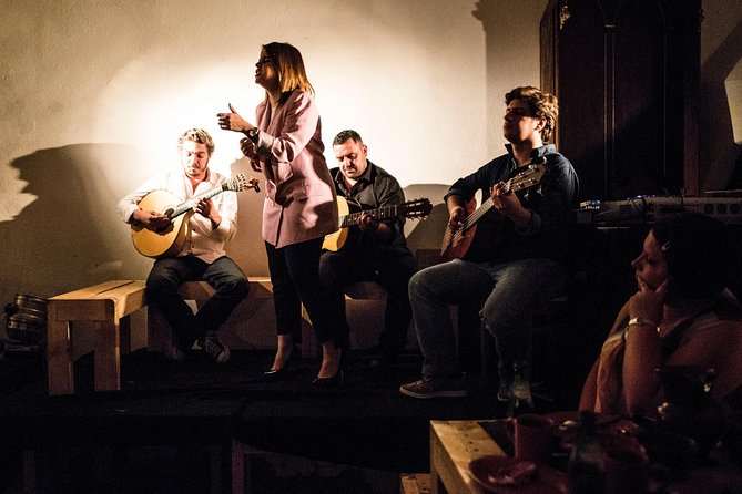 Lisbon Food Tour with 3 Stops and Fado Show Performance - Mercearia petiscos stop: cheese, cold cuts, wine, and the meaning of tapas in Portugal