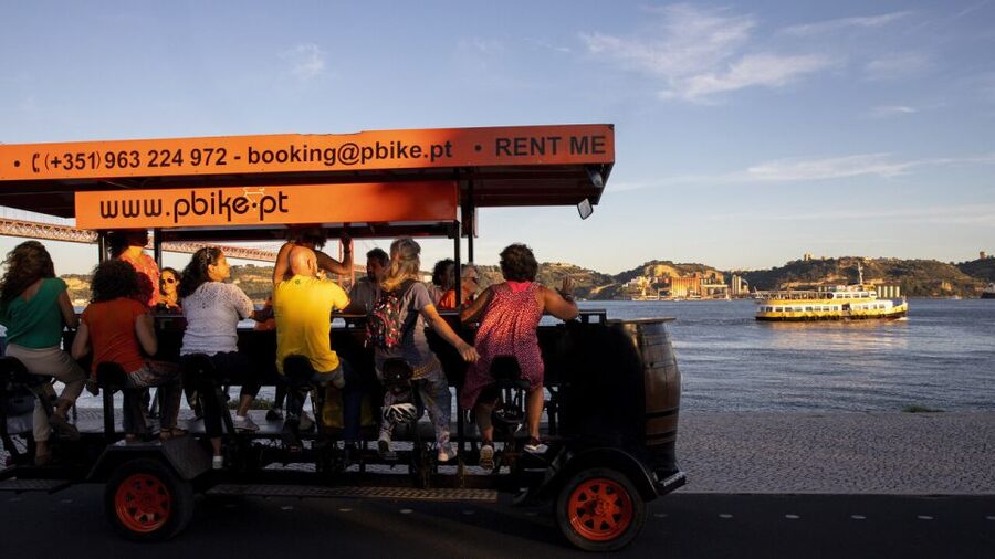 Lisbon: Fun Beer Bike by the Seafront - Pedal along the Tejo seafront, with a real photo moment under 25 April Bridge