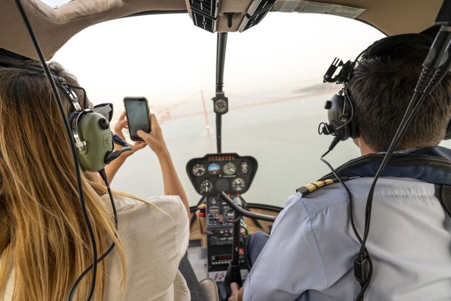 Lisbon: Guided Bike Tour, Helicopter Flight, and Boat Trip - Riding the Tagus toward Belém on an e-bike