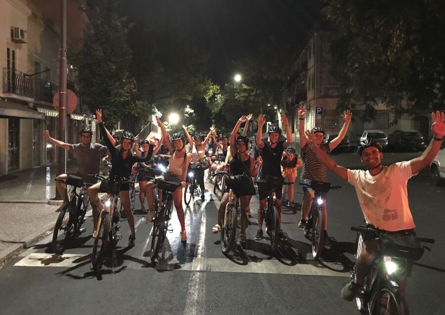 Lisbon: Guided Nighttime Electric Bike Tour - The first climb and the sunset payoff from multiple viewpoints