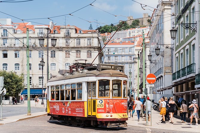 Lisbon: Hop-On Hop-Off Tour Bus with Three Routes Including Tram - Practical logistics: finding stops, handling waits, and using the headsets