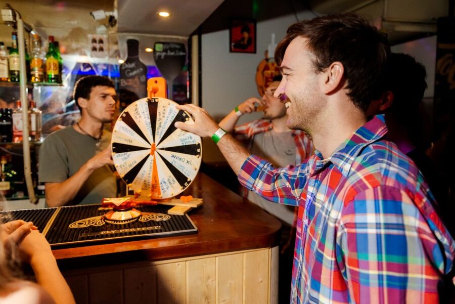 Lisbon PinkStreet Pubcrawl: 1hOpen Bar, Shots,VIP Club Entry - Cais do Sodré for 2.5 Hours: Where the Night Keeps Running
