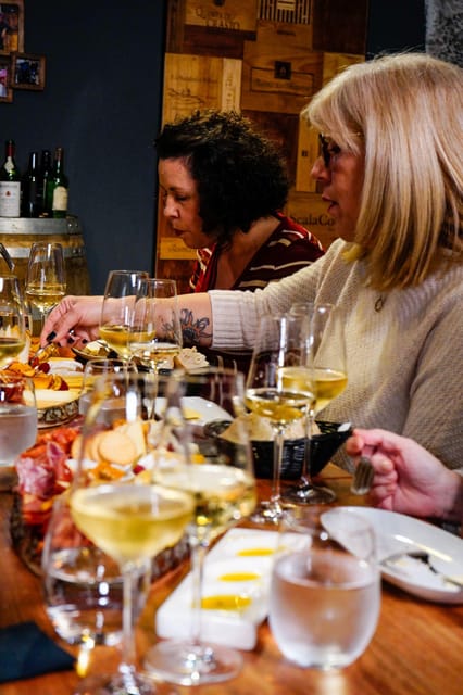 Lisbon: Premium Wine and Tapas Tasting Session - The Lisbon feel: premium atmosphere, local hosts, and a fun group table