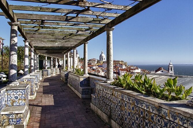 Lisbon Private Tour by Electric Tuk Tuk - Alfama in 1 hour 40 minutes: old houses, Fado, and June festivities