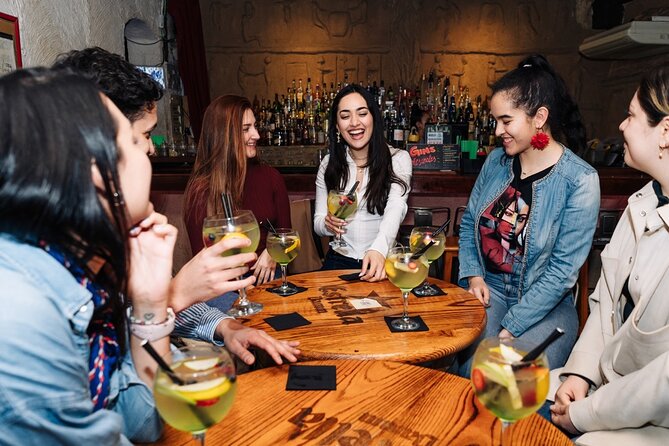 Lisbon Pub Crawl Walking Tour with Drinks Included - Bairro Alto bar hopping: stories, a luck statue, and a club ending