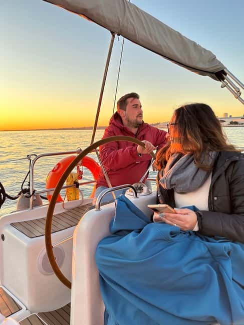 Lisbon: Romantic Cruise with Wine & Portuguese Tapas - 25 de Abril Bridge, Time Out Market, and Ribeira das Naus