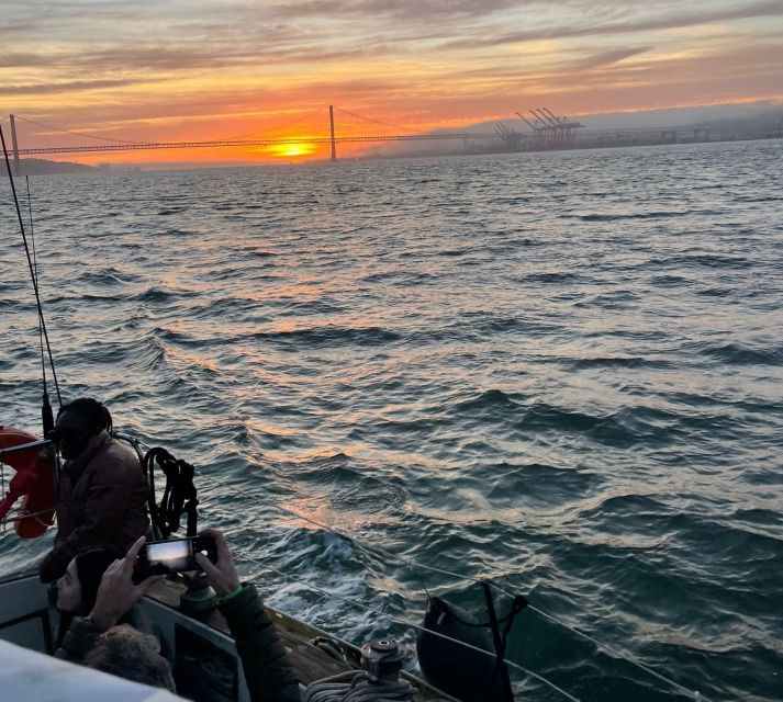 Lisbon: Sailboat Sunset Tour with a Drink - Sailing details: wind, blankets, and getting a fair photo angle