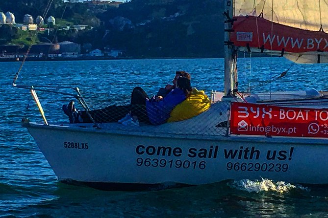 Lisbon Sailing Day Cruise with wine & snacks - From Ponte 25 de Abril to Christo Rei: two famous silhouettes across the water