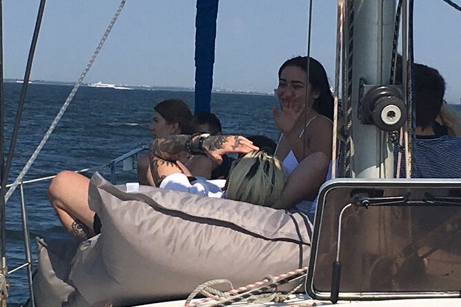 Lisbon Sailing Day Cruise with wine & snacks - Sunset, wind, and the one thing you should dress for