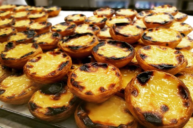 Lisbon Small-Group Food Tour with 18 Tastings in Alfama District - Stop 1: Alfama tastings, sea and land favorites