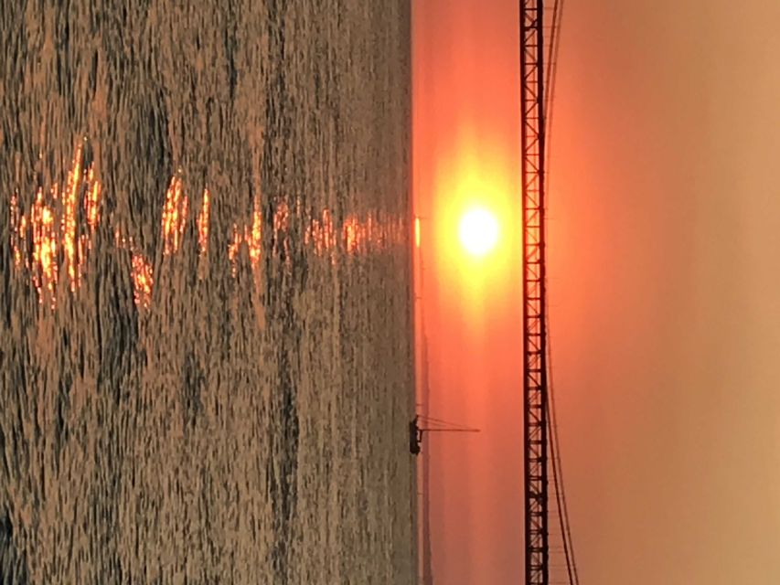 Lisbon: Sunset and Wine Luxury Catamaran Cruise - Belém Tower photo stop: the angle you cannot get from the street