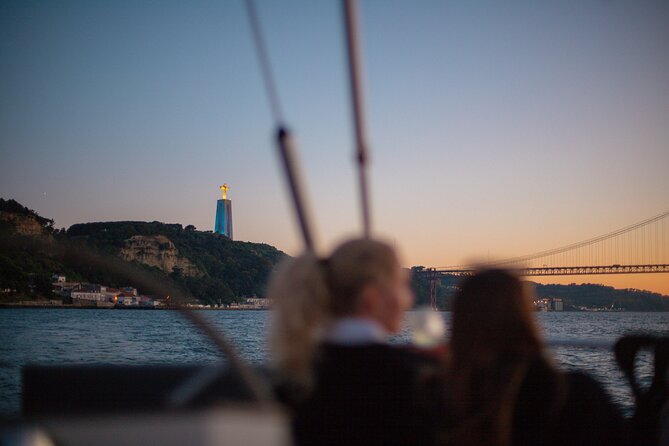 Lisbon Sunset Boat Cruise Tour With Drinks Included - Meeting at the dock, then letting Lisbon roll by