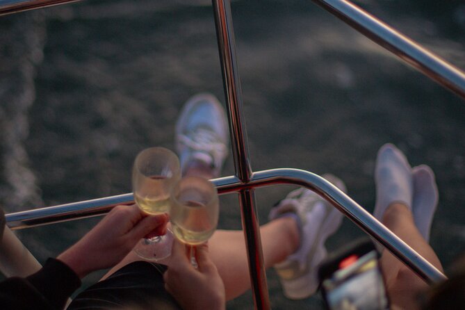 Lisbon Sunset Boat Cruise Tour With Drinks Included - Alfama from the water: castle, cathedral, and winding streets