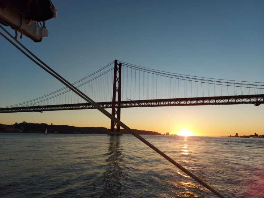 Lisbon: Sunset Catamaran Cruise with Drinks - 25 de Abril Bridge to MAAT Museum: Big Structures, Best Angles