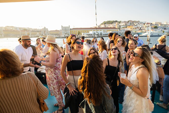Lisbon: Sunset on board with music & drinks - Drinks and Comfort: Welcome Sip, Then Your Choice