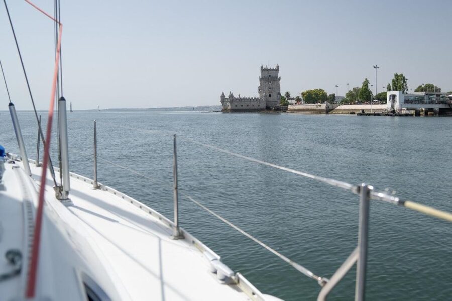 Lisbon: Sunset Sailing with Portuguese Wine and History - The onboard vibe: wine, stories, music, and feeling safe
