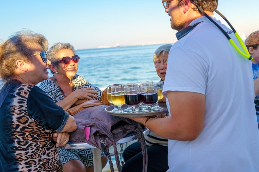 Lisbon: Tagus River Sunset Tour with Snacks and Drink - Christ the King pass-by: city overview without the hike