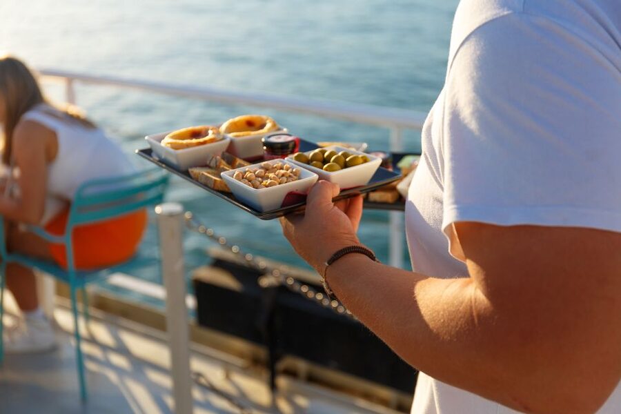Lisbon: Tagus River Sunset Tour with Snacks and Drink - 25 de Abril Bridge: the signature photo moment up close