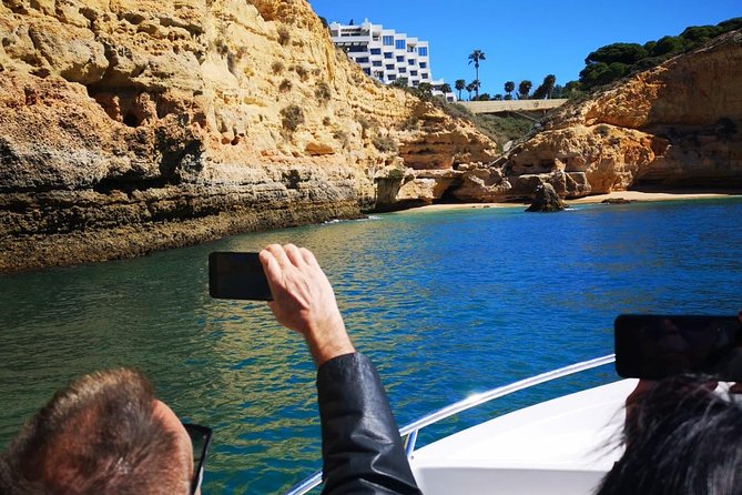 Lisbon to Algarve Private Tour: Benagil Caves Cruise & Top Sights - Praia do Carvoeiro: cliffs, turquoise water, and a short landing