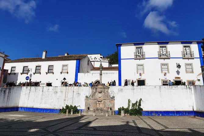 Lisbon to Porto Up To 5 Stops Óbidos Nazaré Fátima Coimbra Aveiro - Fátima: basilicas, mass options, and how to plan for religious items