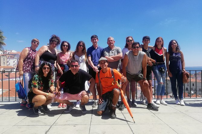 Lisbon Walking Tour - The Perfect Introduction to the City - Meeting at Praça do Comércio, then walking Lisbon with an orange-umbrella guide