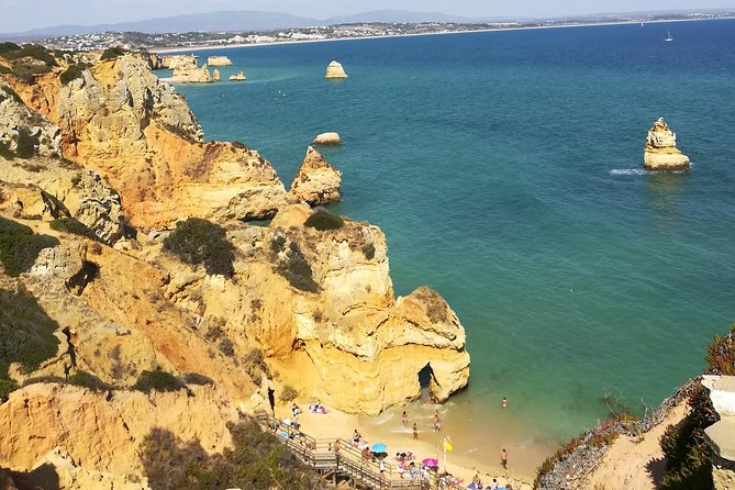Private Algarve: Benagil Caves, Lagos Cliffs & Hidden Beaches - Praia dos Estudantes: a cliff tunnel entrance and Roman-style stone details