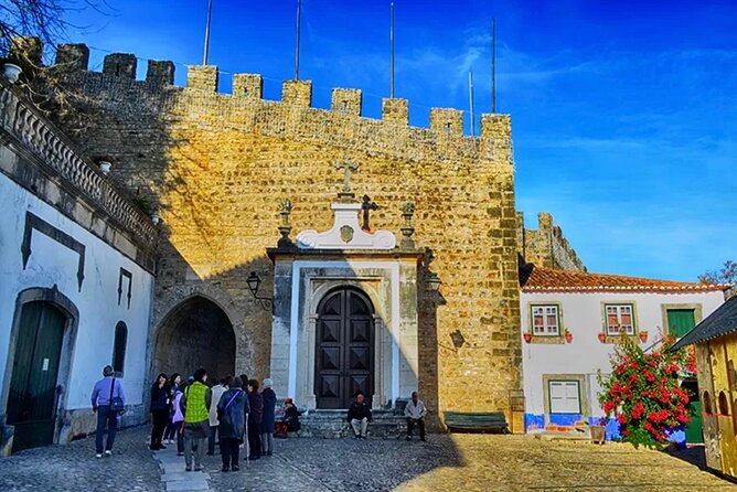 Private Lisbon to Fátima, Nazaré & Óbidos Tour – Spirit & Charm - Óbidos medieval lanes, castle walls, and the ginjinha tradition in chocolate cups