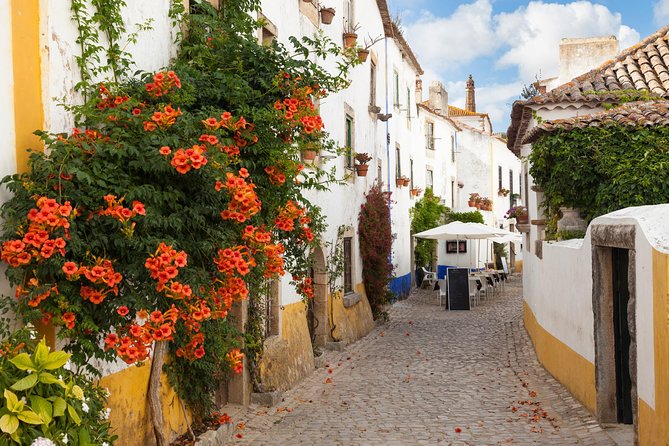 Private Tour Fátima, Nazaré, and Óbidos Day Trip from Lisbon - Stop 3: Nazaré fishing village, lunch on your terms