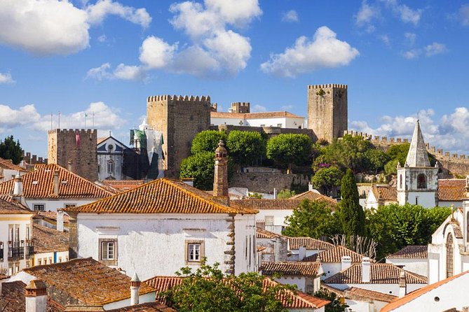 Private Tour Fátima, Nazaré, and Óbidos Day Trip from Lisbon - Stop 4: Óbidos walls, flower pots, ginja tasting, and ceramics