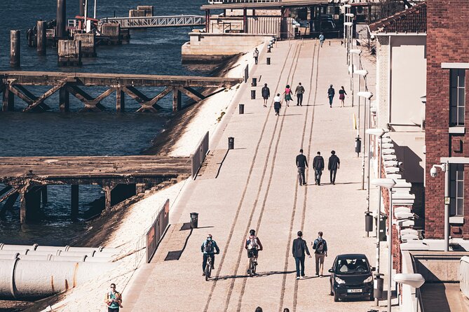Riverside Ride Audio Adventure Lisbon to Belem - Alcantara Edge: Riverside Bars, Restaurants, and Bridge Photographs