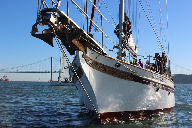 Tagus River - Private Tour on Vintage Sailboat - Passing under the 25 de Abril Bridge, with Cristo Rei in view