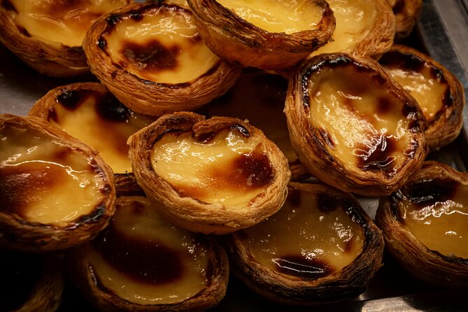 Taste Lisbon: an Itinerant Full Portuguese Meal by Do Eat Better - Chiado stroll and bifana: landmarks plus a proper sandwich
